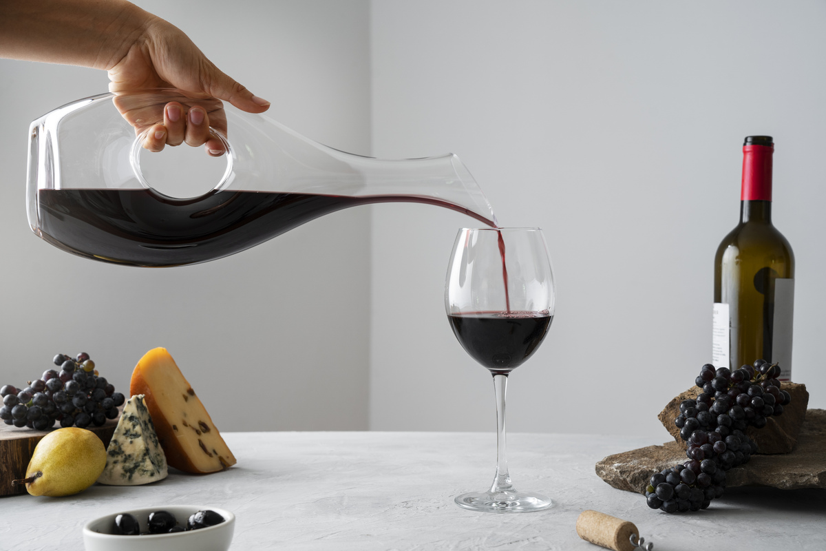 Pouring best wine for every occasion, with cheese, grapes. Pouring best wine for every occasion, with cheese, grapes.
