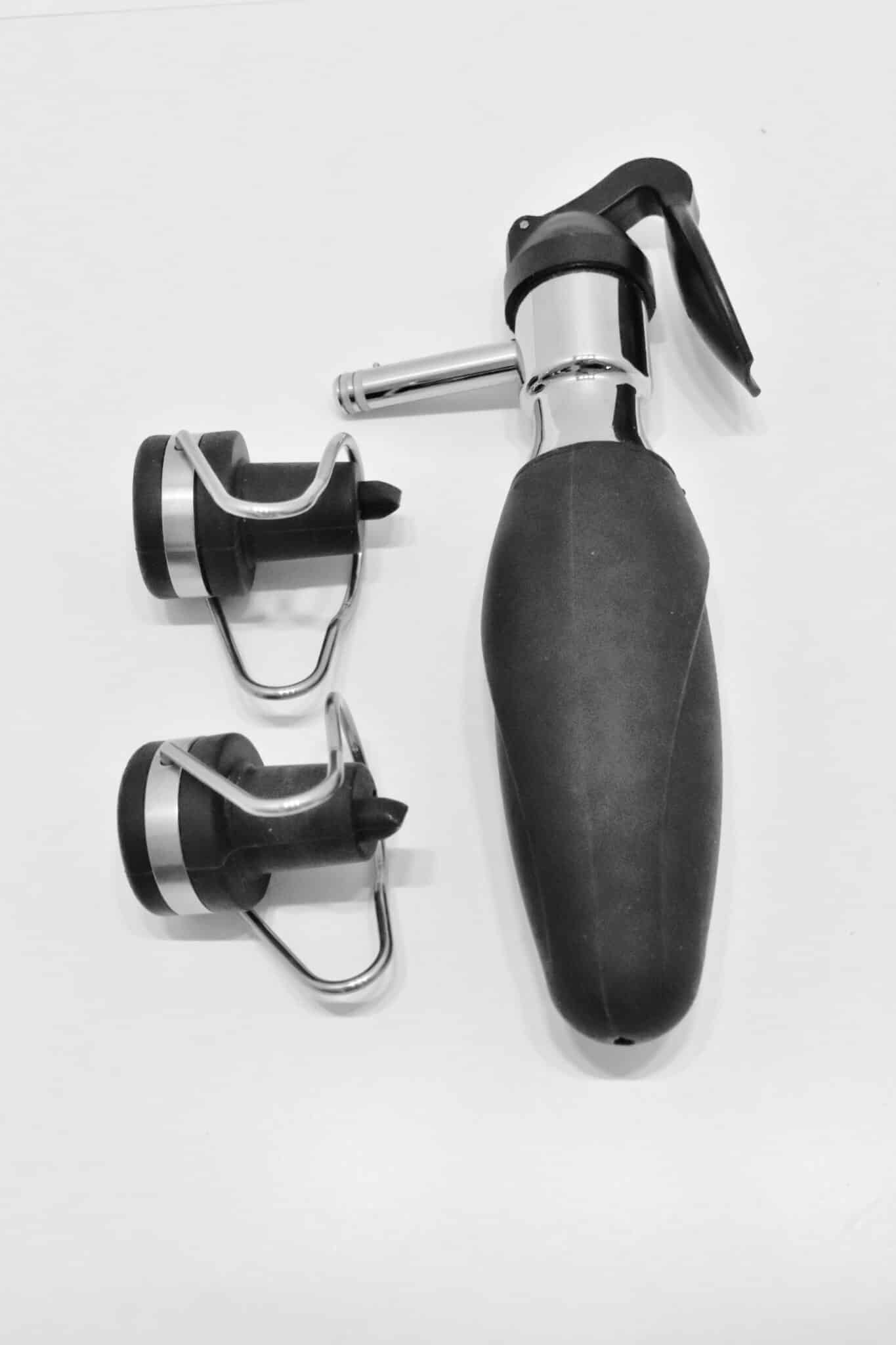 Wine preservation lever and two nozzle attachments with a black, ergonomic handle accessory, suited for wine gas cartridges